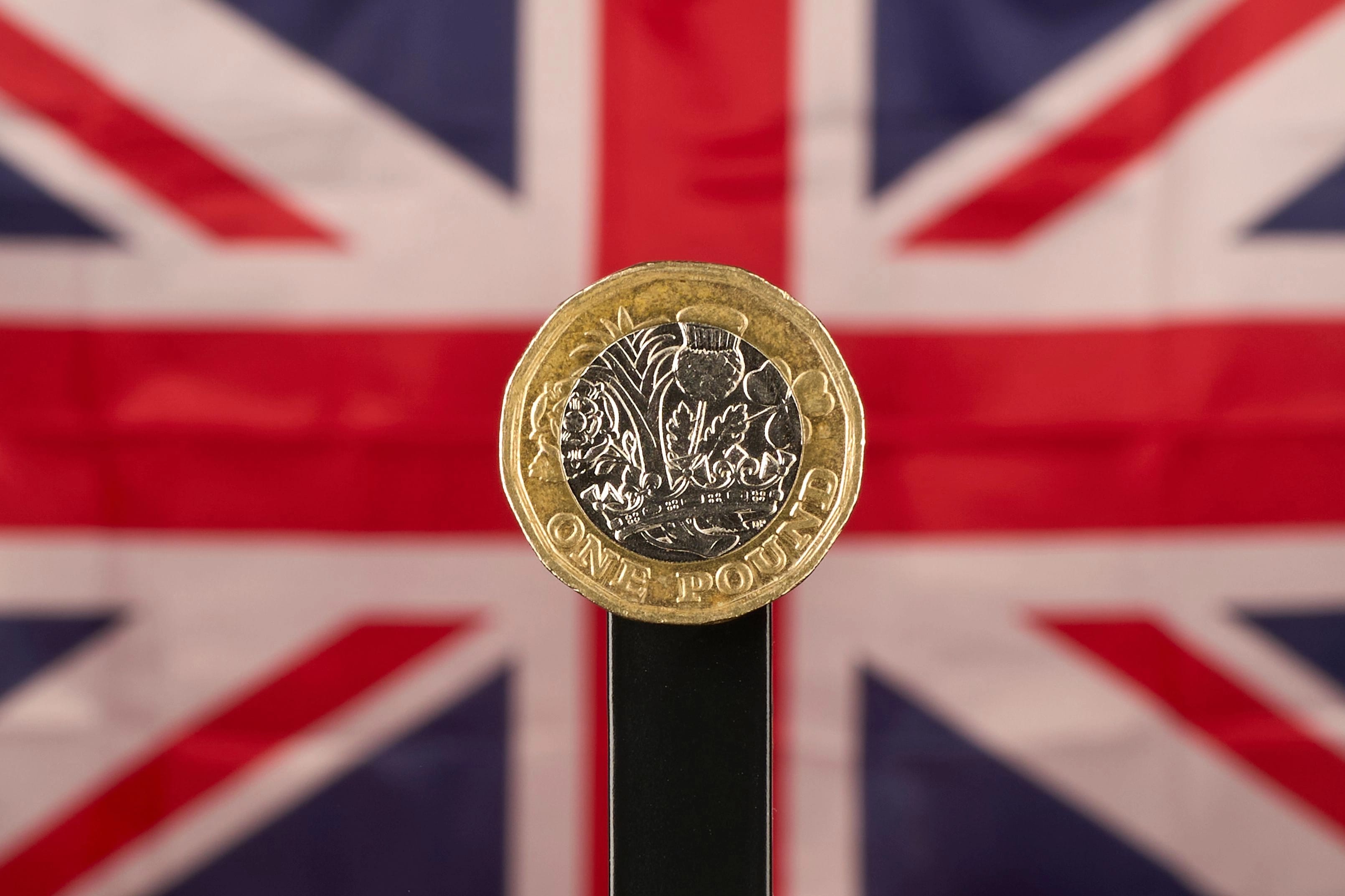 British One Pound Coin With Union Jack Flag In The Background, San Ferdinando Di Puglia (Bt), Italy - 09 Oct 2025